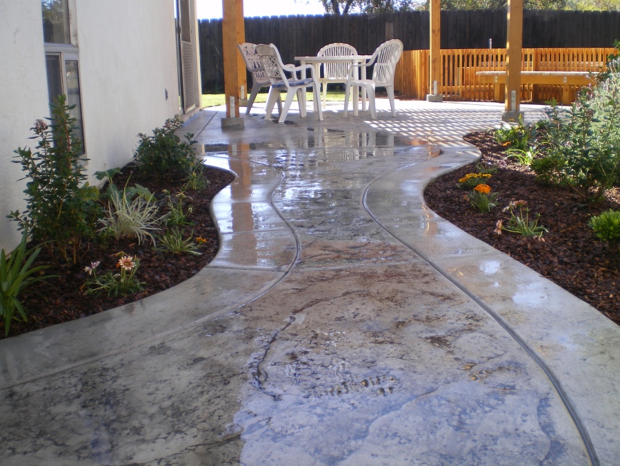 After- stamped concrete patio and walkway  Peak Landscape Design
